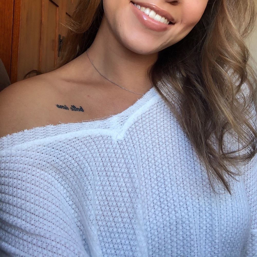 White distressed end sweater